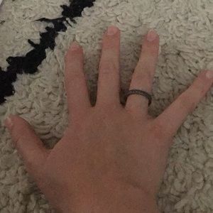 Silver ring, with fake diamond lacing.